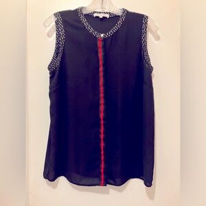 Black sleeveless blouse brand Les Petites.